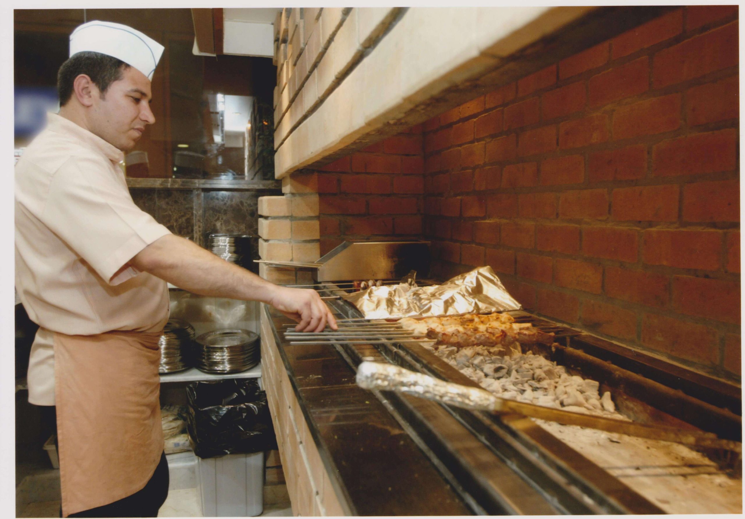 the cook is preparing barbecue in the kitchen